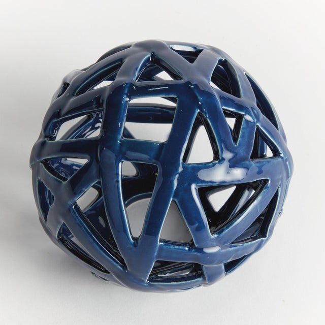 This contemporary little orb is made of thin ceramic strips, which are hand formed, and sparingly shaped into a rounded...