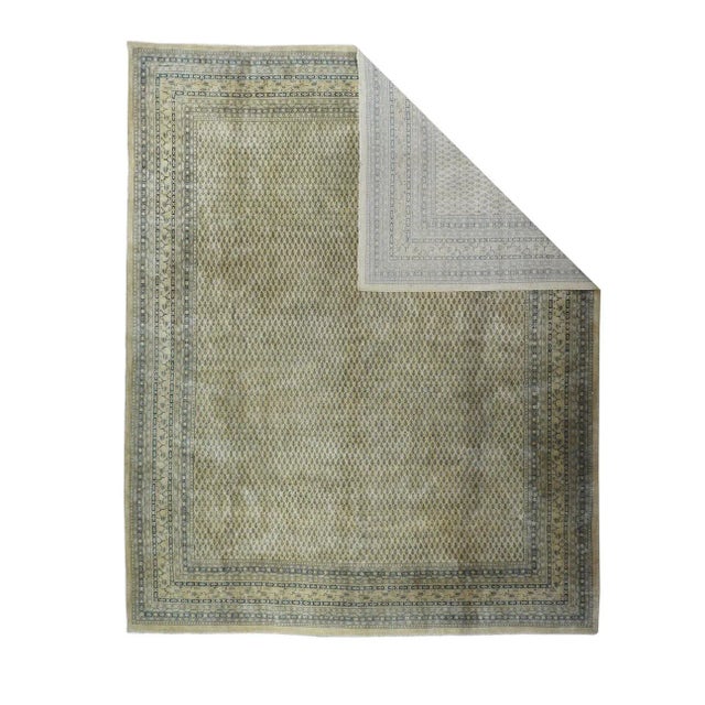 The straw-sand field shows literally thousands of tiny offset-row reversed botehs, Twelve patterned minor borders and a...