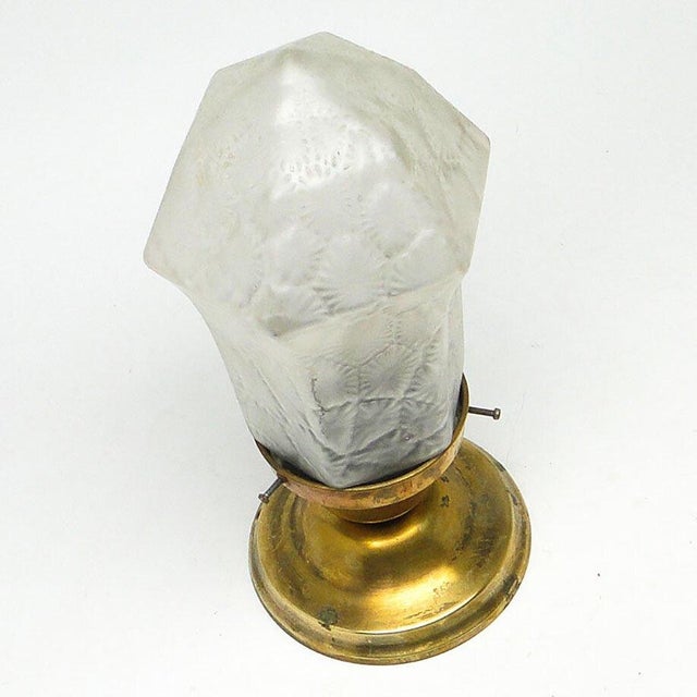Pendant lamp produced at the beginning of the twentieth century. The construction of the lamp is made of brass, and the...