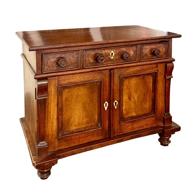 An exceptional Italian tabletop chest, dating to circa 1800–1820, showcasing the refined craftsmanship and ingenious...
