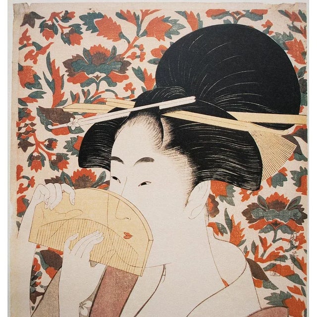 An excellent reproduction of Kitagawa Utamaro woodblock print Beauty Holding A Comb. One of the original woodblocks by the...