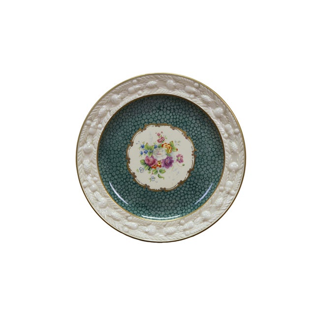 Twelve rare antique Adams Royal Ivory Titian Ware fruit plates. They feature a hand-painted floral arrangement in the...