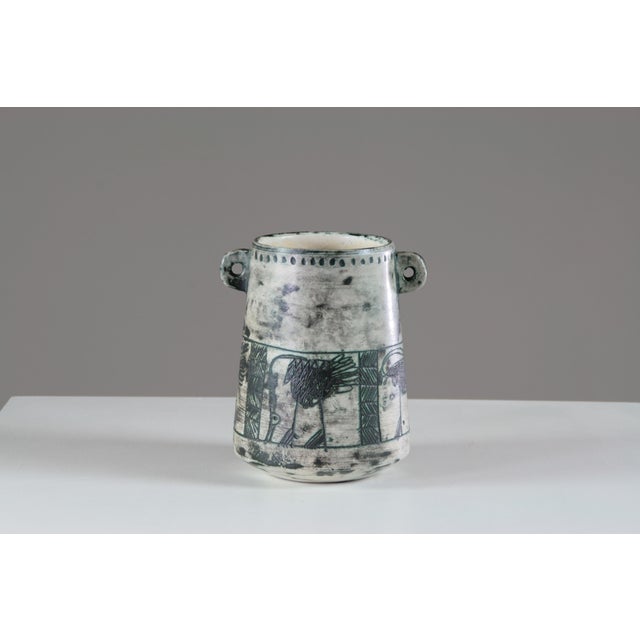 This vase, signed Jacques Blin, is a remarkable ceramic work that showcases the artist's unique style. Its clean lines and...
