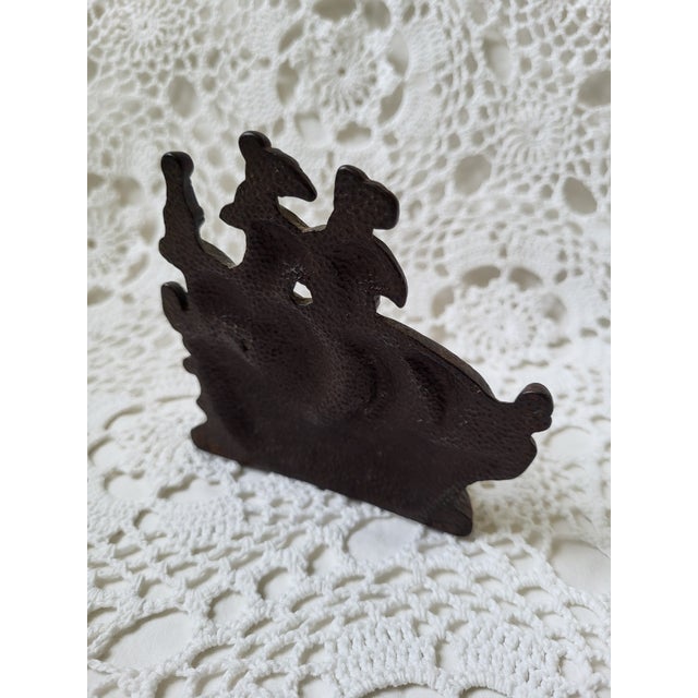 A mini cast iron clipper ship sailboat bookend or doorstop, perfect for a home office or den. It measures 4” across x 1 ½”...