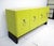 A stunning and luxurious chrome studded lemon-yellow credenza sideboard with four doors having heavy chromed handcuff...
