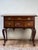 A handsome 18th-century American Queen Anne walnut lowboy dating to circa 1740–1770, with the graceful proportions and...