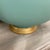 Very unique vintage glass globe table lamp with a painted aqua colored finish. Gold accents and finial with a neutral...