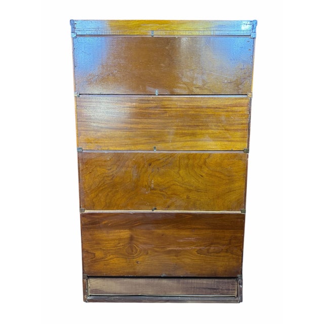 Antique Lawyers Bookcase with original finish It has four removable sections with bottom section having drawer.