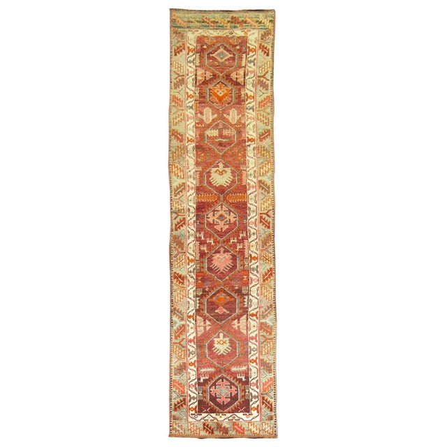 Vintage one of a kind Armenian runner with predominant accents in brown, burgundy and green on all-over design. Measures:...