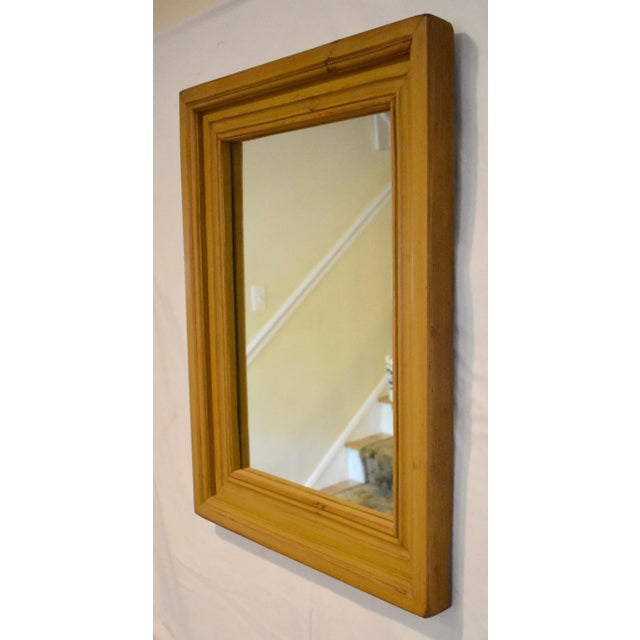 This handsome and versatile pine wall mirror has a bold, nicely-contoured frame, 3.5" wide and 2" deep, made from...