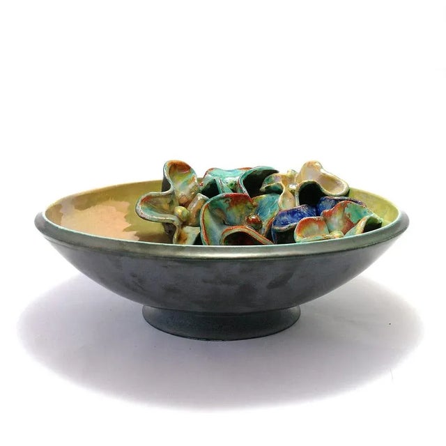 Boccola luster and flowers shades copper, made and decorated by hand in majolica of Faenza. Dimensions: diameter 32 x h 9...