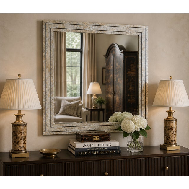 Elegant Maitland-Smith tessellated stone mirror featuring a refined geometric frame in warm neutral tones with subtle...
