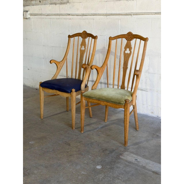 This vintage set of 2 armchairs features an elegant high-back silhouette with subtly curved armrests and contoured back...