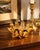 A striking vintage hand-blown art glass vessel in luminous amber with smoky espresso accents and an expressive biomorphic...