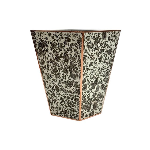 Marble paper, each one of a kind, copper and wood made into wastebasket. Measuring 8″ x 4.75″ x 11″ tall.