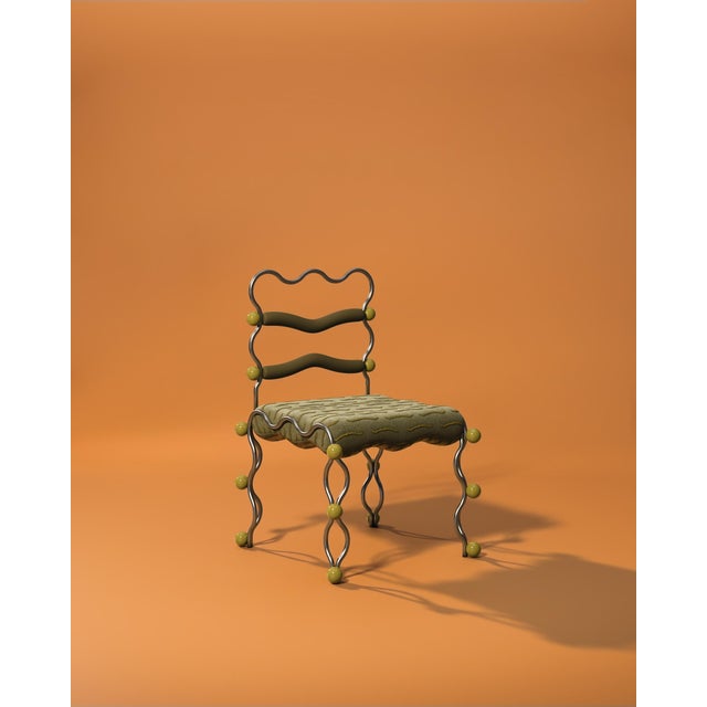 The Vela Dining Chair, designed by Omer Ozturk for Malabar, expresses a contemporary interpretation of movement within a...