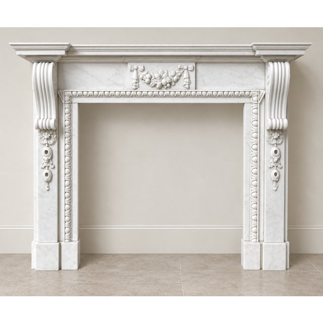 A fine pair of large antique Edwardian white marble fireplaces, dating to circa 1901, each beautifully carved and of...