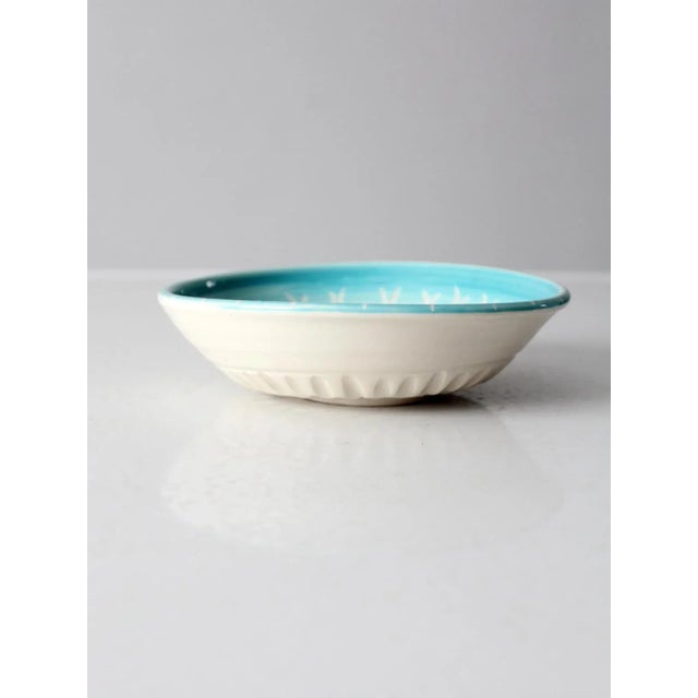 This vintage studio pottery bowl has a cheery polka dot design. Signed by the artist, the handmade bowl has a turquoise...