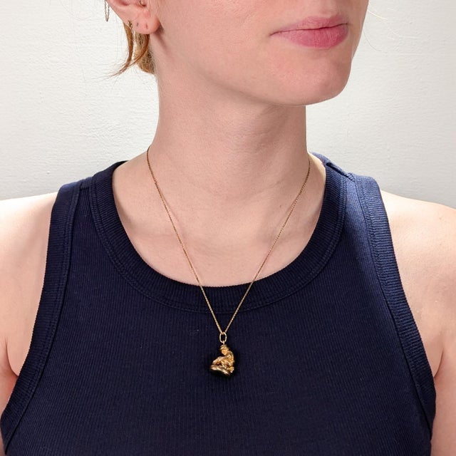 A fine antique gold & jade seal watch fob or charm. In 9 karat yellow gold. With a bezel-set jade cabochon to the base....