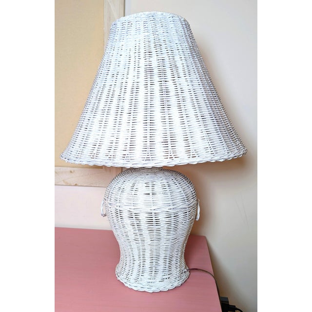 This is a lovely vintage wicker ginger jar shaped lamp and matching wicker cone shade. It is believed to date to the late...