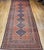 This early 20th century Persian Malayer gallery rug presents a compelling example of village weaving, defined by its...