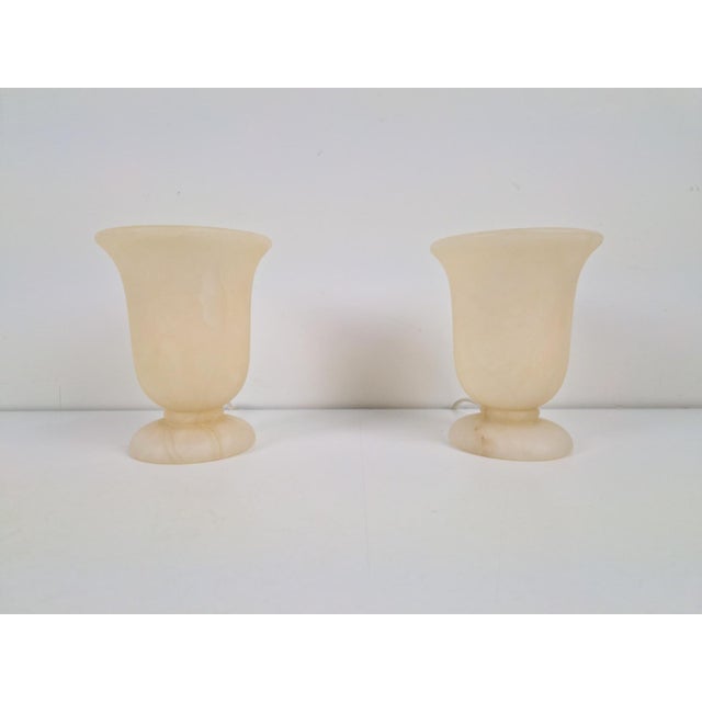A pair of neoclassical goblet-shaped alabaster table lamp, by master spain, 1980 measurements: w 12.5 cm x d 12.5 cm x h...