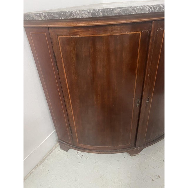 Louis xvi style half-moon corner cabinet two doors inlaid with light wood stringing mahogany veneer on an oak background...