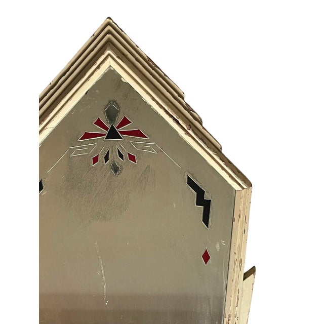 Art Deco mirror with painted motif and staggered pointed frame. Aged to perfection.