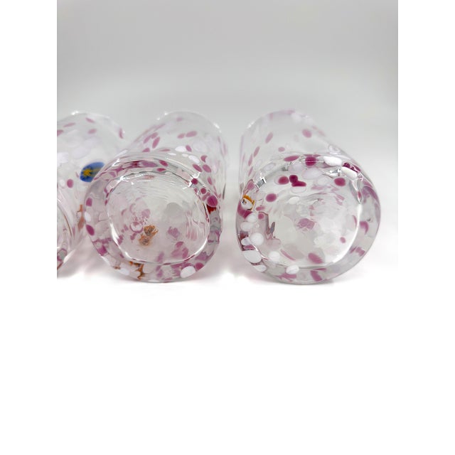 A striking set of four hand-blown Italian art glass tumblers attributed to Alessandro Coppola based in Murano, Italy ....