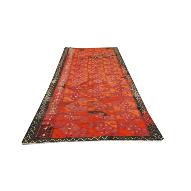 Decorative handwoven vintage kilim rug from Kars region of Turkey. Approximately 50-60 years old. In very good condition.