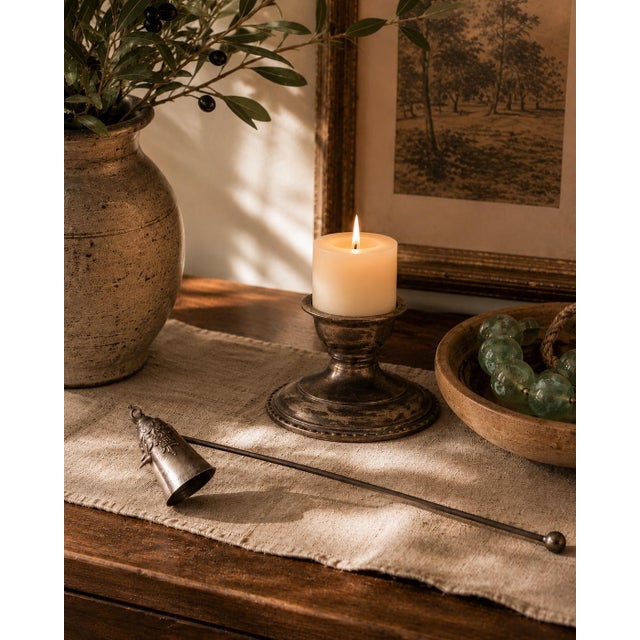 Add a touch of vintage elegance to your candle collection with this beautiful Wallace silverplate candle snuffer....