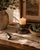 Add a touch of vintage elegance to your candle collection with this beautiful Wallace silverplate candle snuffer....