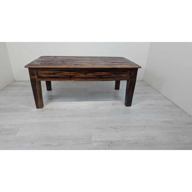 Solid Exotic Wood Coffee Table A colonial-style solid wood coffee table featuring a woven pattern on the drawer front. It...