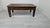 Solid Exotic Wood Coffee Table A colonial-style solid wood coffee table featuring a woven pattern on the drawer front. It...