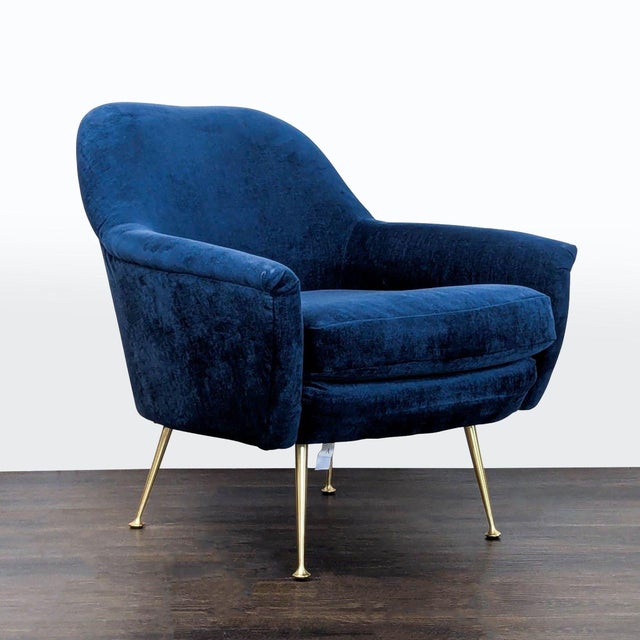 Add style and comfort to your space with this West Elm lounge chair. It features soft blue velvet upholstery and sturdy...
