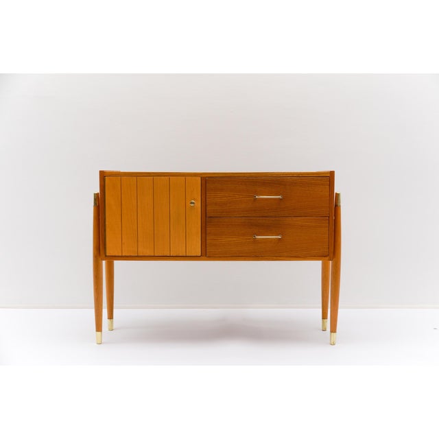 Beautiful condition, slight signs of wear. Polished brass trim. Lined inside with original colorful paper. This piece has...