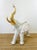 Vintage 1980s White & Gold Ceramic Elephant Statue made of a ceramic type material golds white with gold metallic accents...