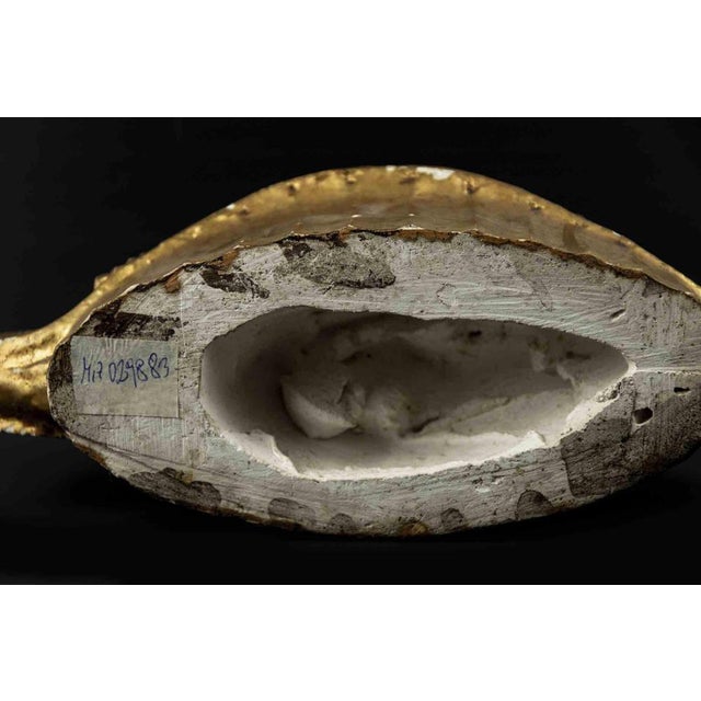Gilded terracotta centerpiece is an original modern object realized in the mid-20th century. Original gilded terracotta....