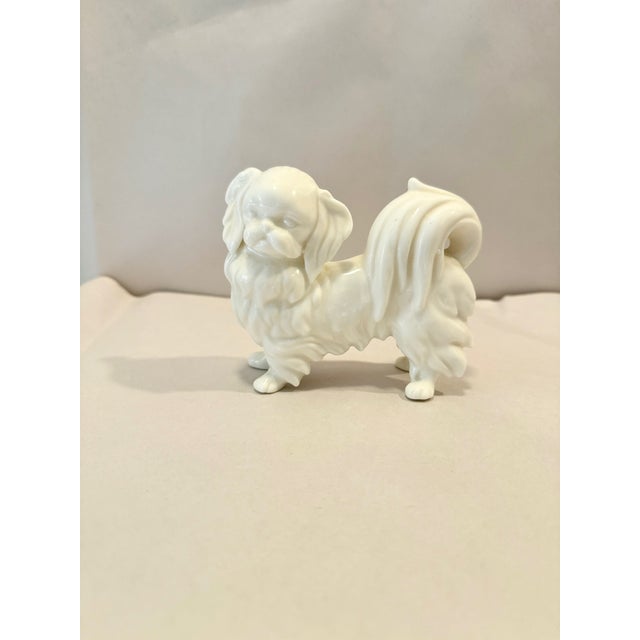 Charming pekinese figurine. White porcelain; understated and beautiful. No maker's mark. Good vintage condition; signs of...