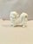 Charming pekinese figurine. White porcelain; understated and beautiful. No maker's mark. Good vintage condition; signs of...