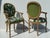 Pair of hand carved faux bois rope and tassel Palm Beach Regency arm chairs upholstered in tropical Floridian fabric.