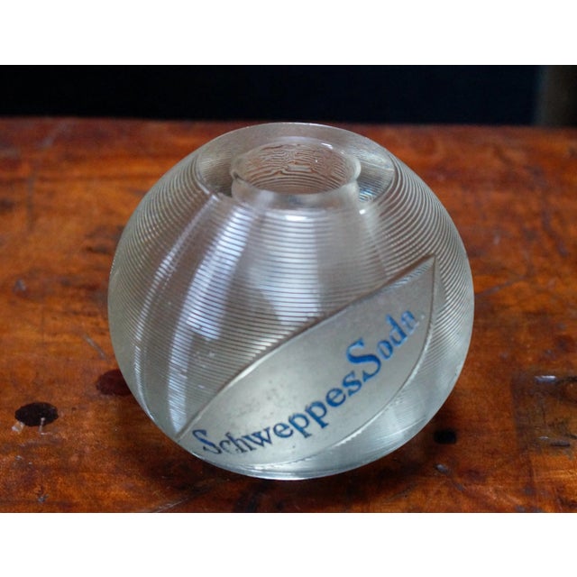 Vintage heavy glass advertising match holder and striker marked ''Schweppes Soda”. This is a glass ball with rings all...