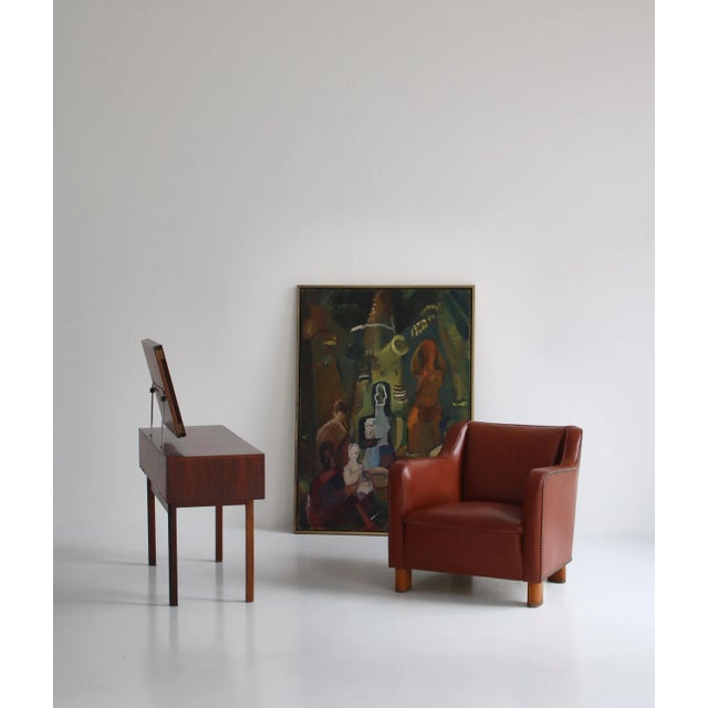 Beautiful authentic Danish Modern easy chair made and designed in the 1940s at Fritz Hansen & Co., Copenhagen. The chair...