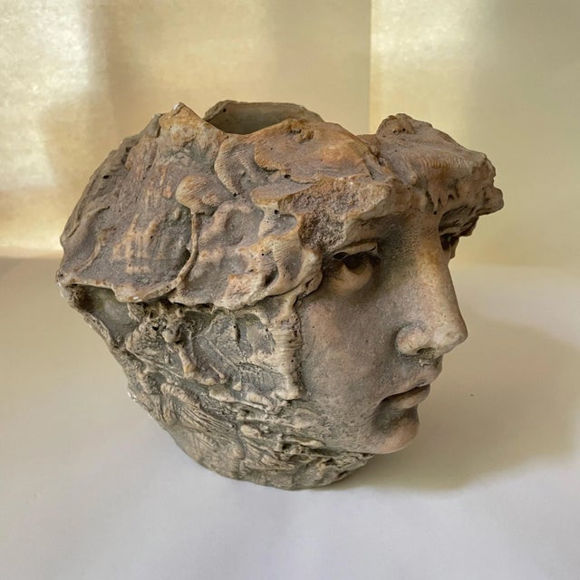 This striking vintage figural face planter dates to the 1980s and is crafted from cast stone (cast concrete). Featuring a...