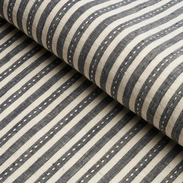 Printed on a linen-hemp blend with a running-stitch detail, Mathis Ticking Stripe is an interesting, textural take on...