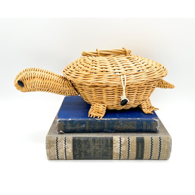 Charming, diminutive turtle-shaped box handwoven from warm honey-toned wicker and accented with sweet black bead eyes. The...
