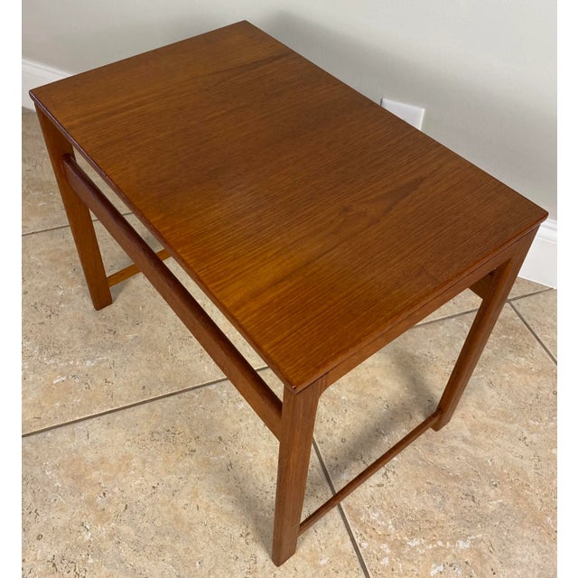 A very nice quality set of 3 French mid-century wooden nesting tables. Constructed in durable teak. Designed in a...