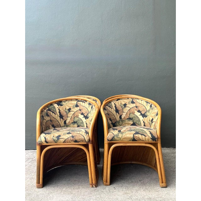 These vintage pencil reed sunburst dining chairs capture the sculptural elegance and organic sophistication associated...