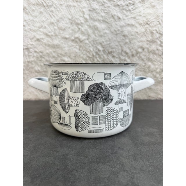 Vintage pot with handles and lid made of enamel over metal. The pot is decorated with stylized mushrooms and was designed...