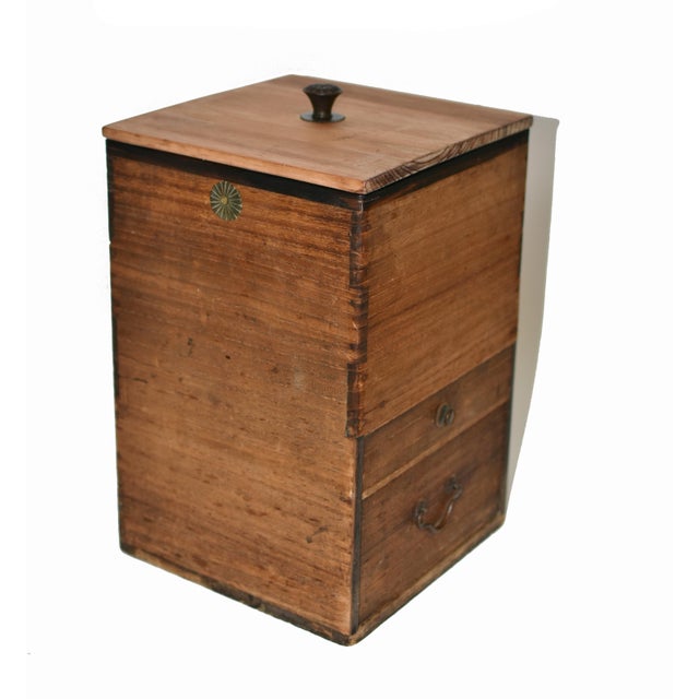 A 19th-century Japanese solid wood storage box in excellent condition, exemplifying fine craftsmanship and timeless...